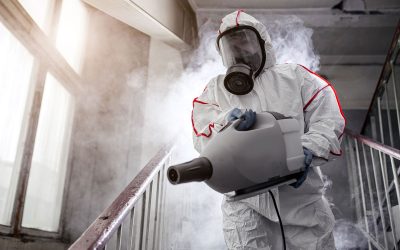 Trauma Cleaning Services | Water Damage Restoration in NC | Restoration Carolina Inc professional-disinfector-with-protective-antiviral-mask